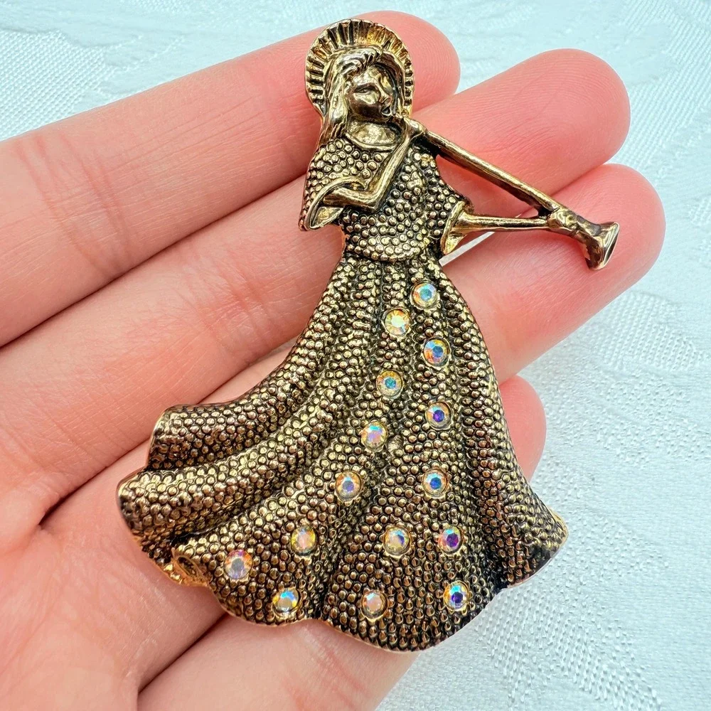 Vintage Gold Tone Girl Playing Alphorn Instrument Brooch w/ AB Rhinestones